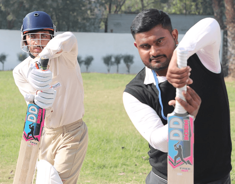 AIS sports coach training students on the field