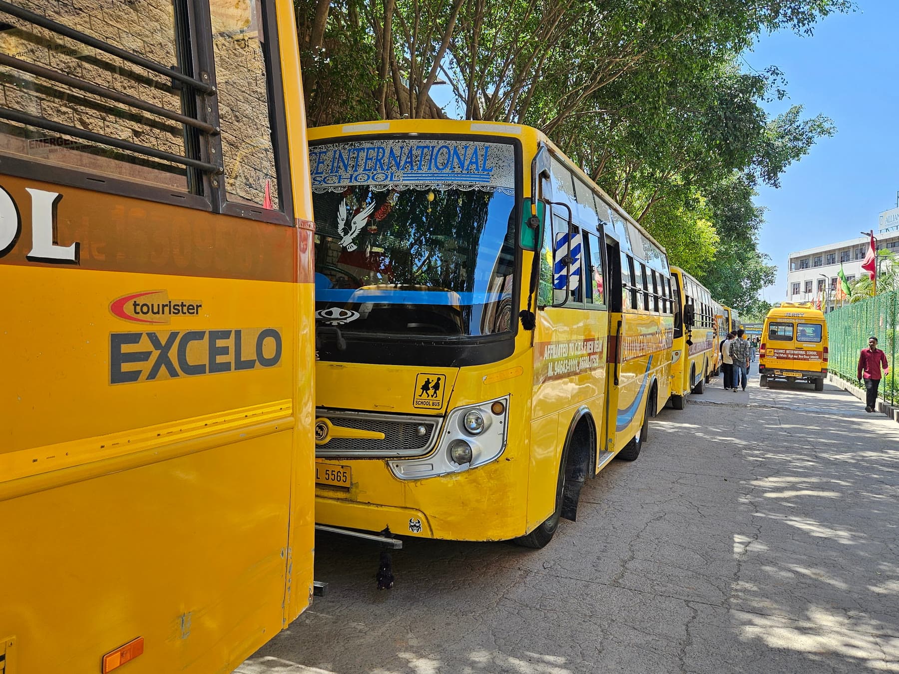 The Alliance International School bus fleet lined up at the school gate